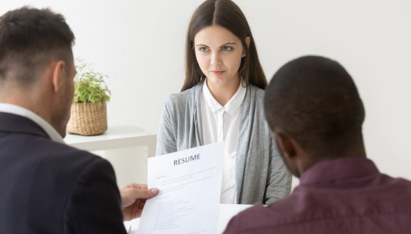 Woman showing a federal resume for a government job