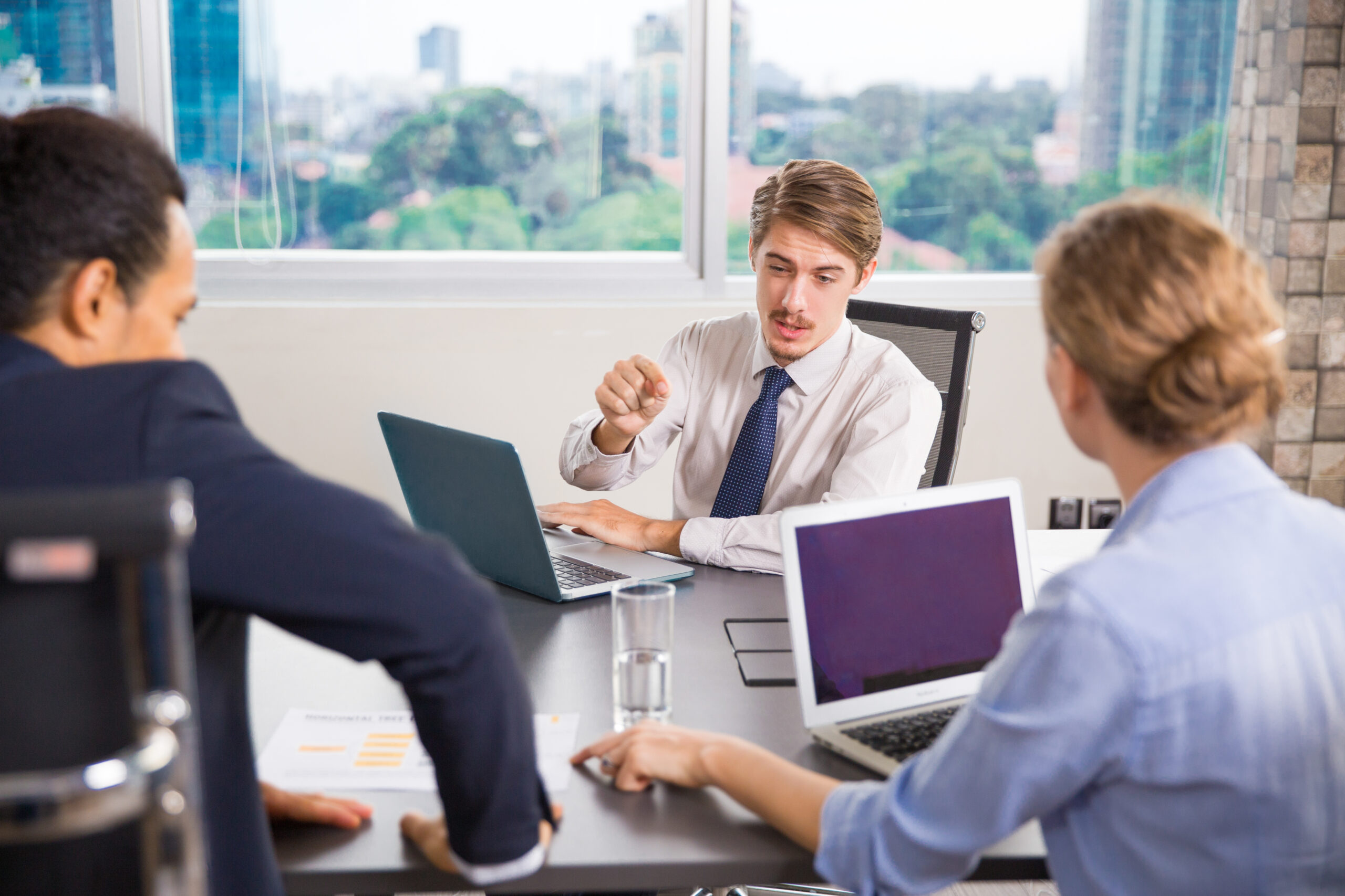 office environment with employees working on computers