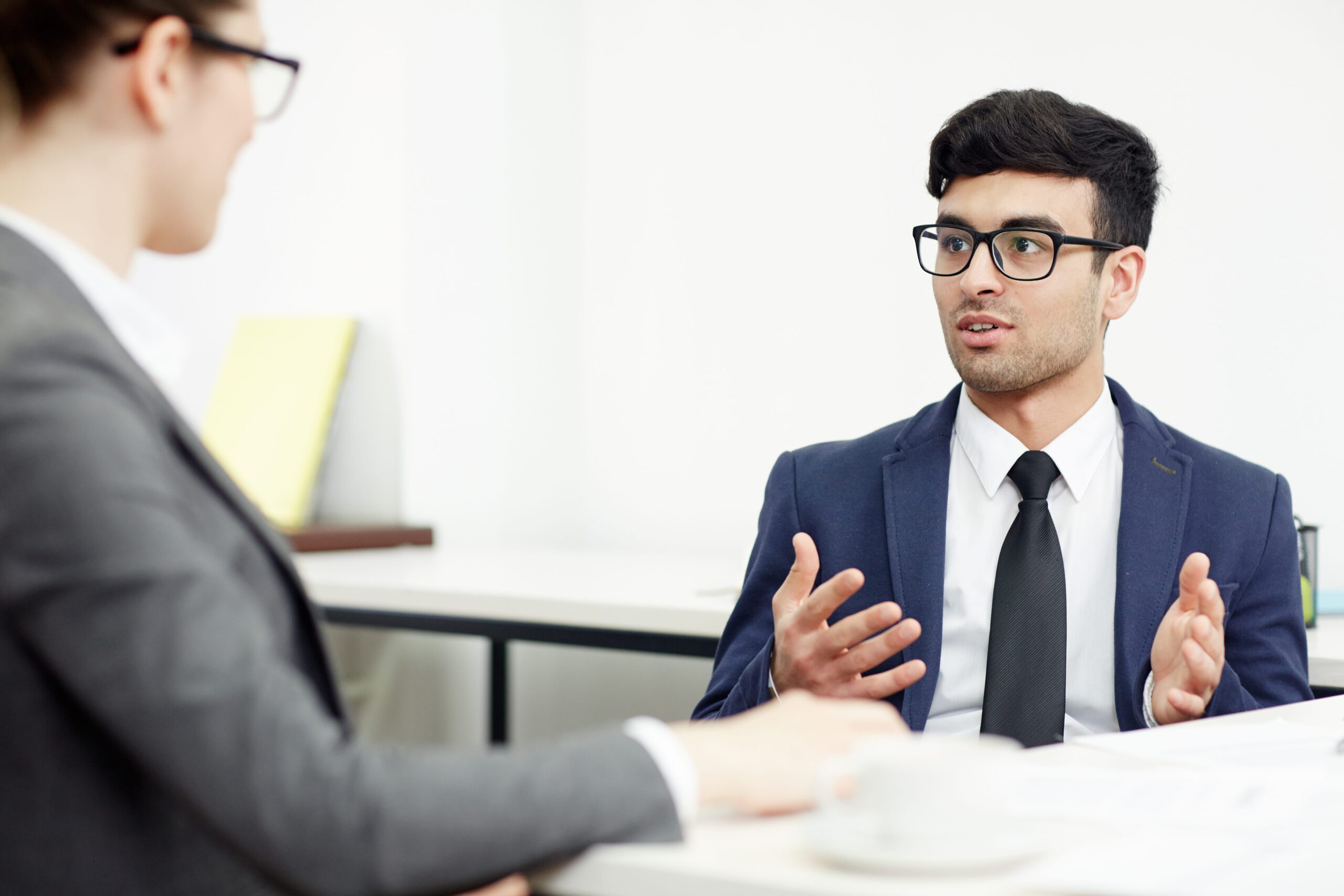 A young man sitting in an interview