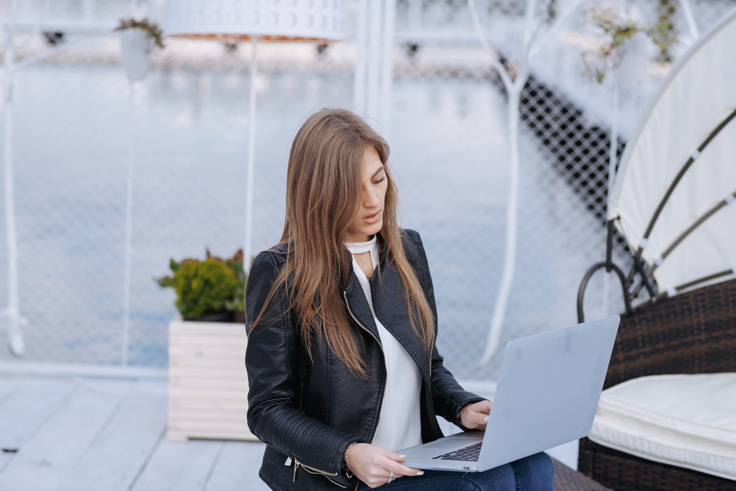 person checking job listings for USA visa sponsorship on laptop