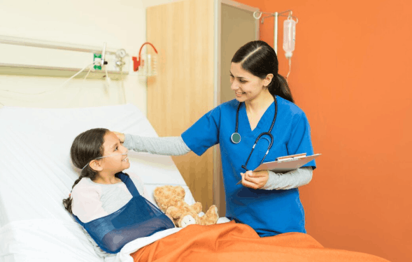nursing assistant helping patient USA hospital