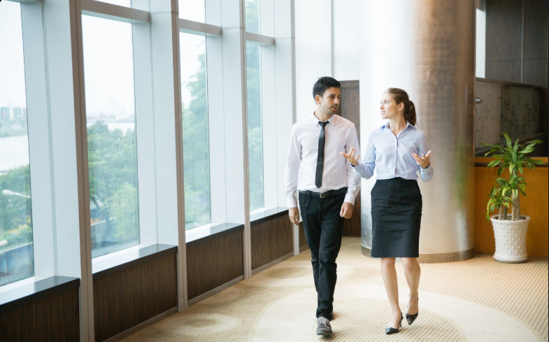 Business professional celebrating a successful M&A deal close at a corporate office in the United States Senior Manager Corporate Development and M&A