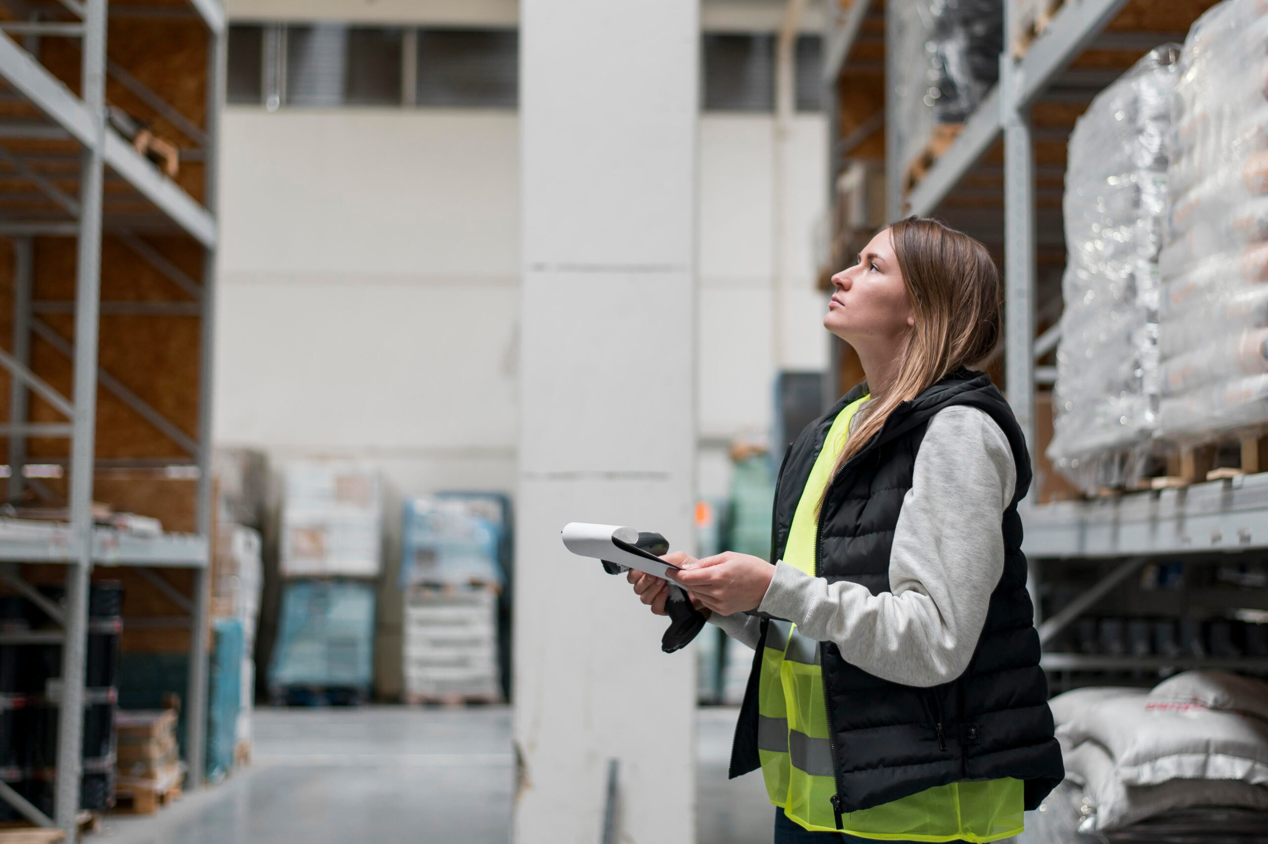 Girl searching package in Amazon warehouse