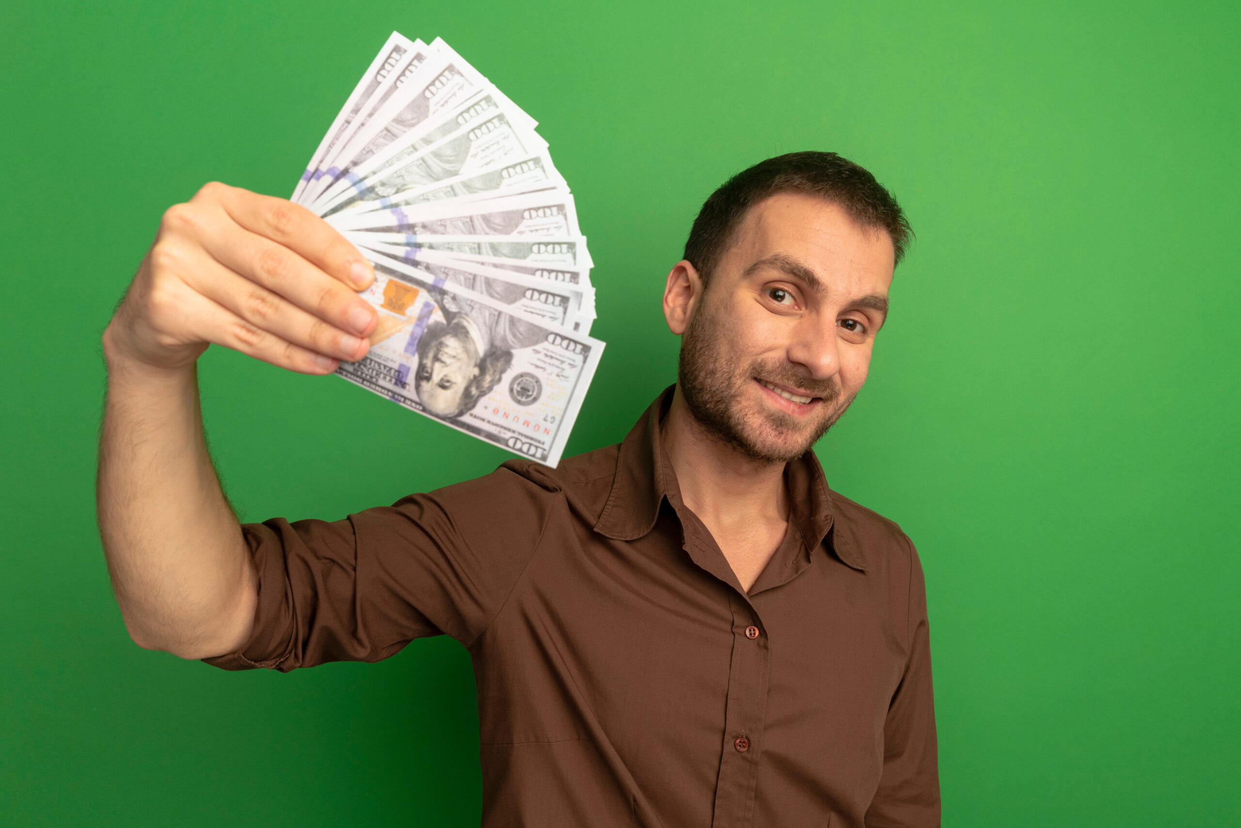 Worker holding cash showing hourly pay for warehouse job