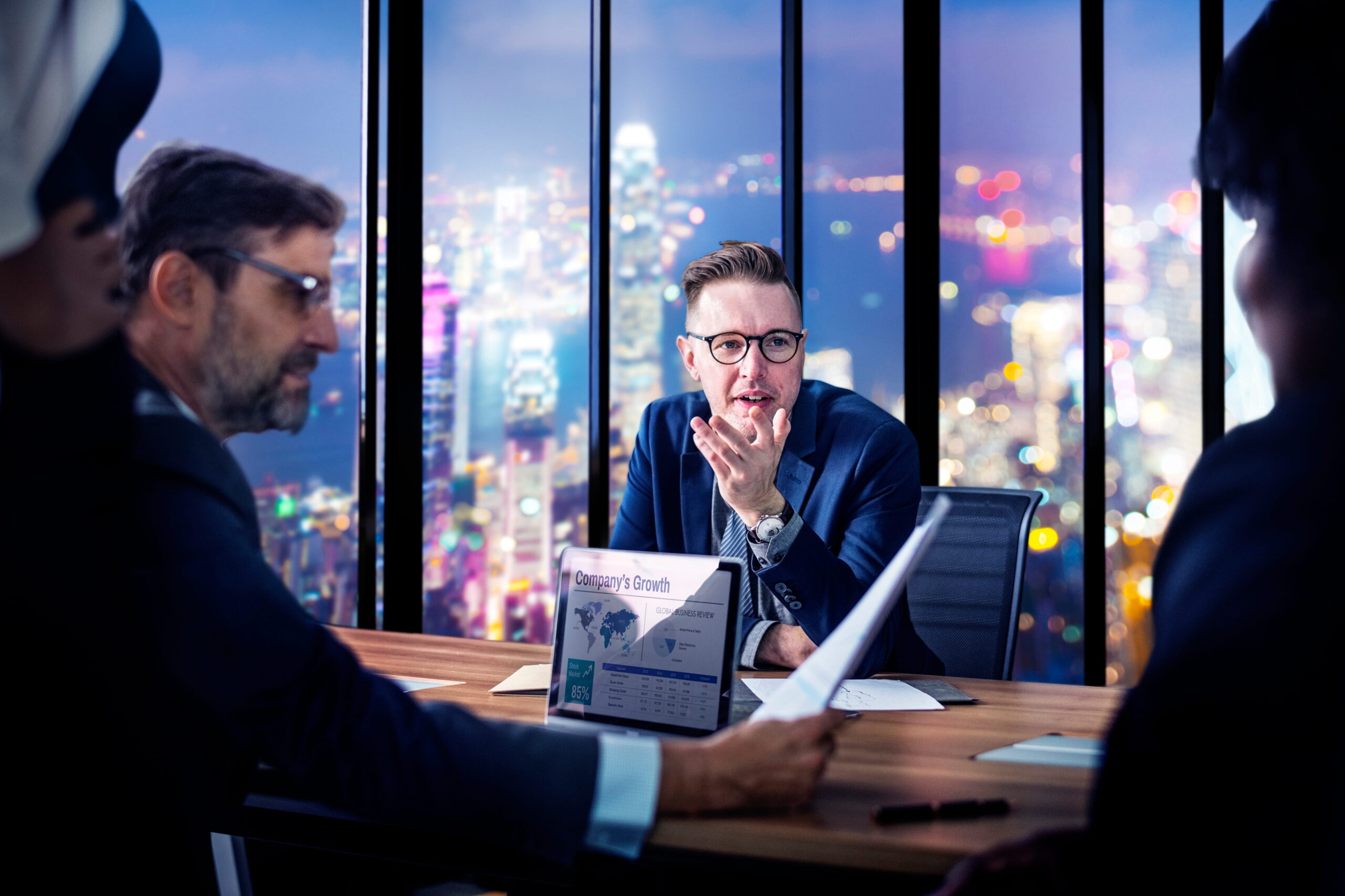 Financial Manager reviewing company budgets, financial reports and business growth strategies in a modern corporate office